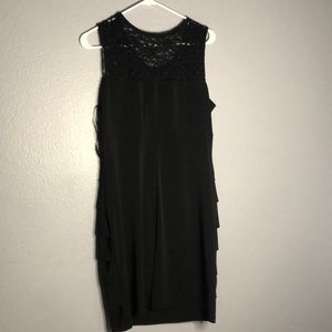 I am selling a black dress with transparent flower top.